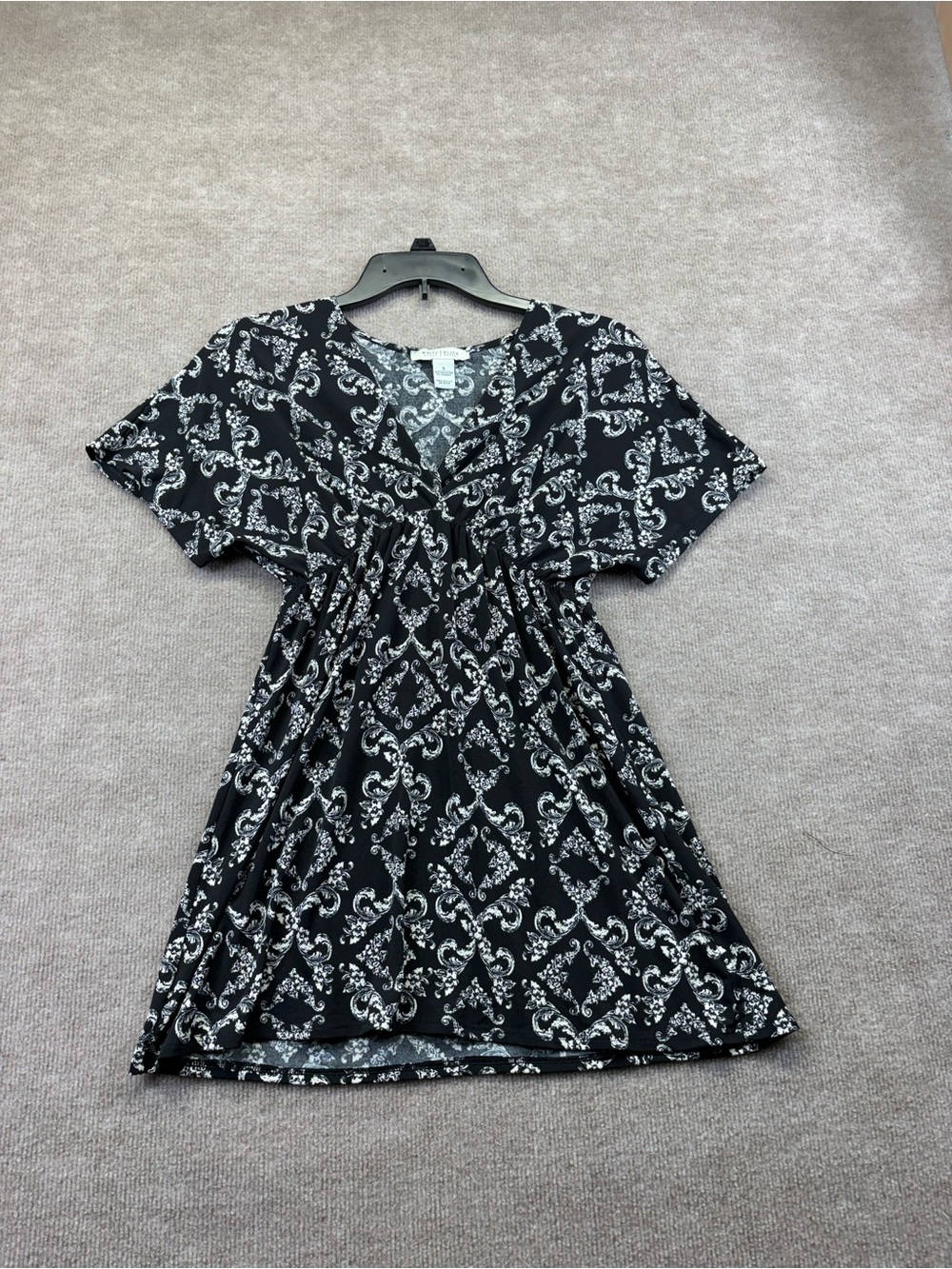 White House Black Market top in a size S V neck with elastic band under breast